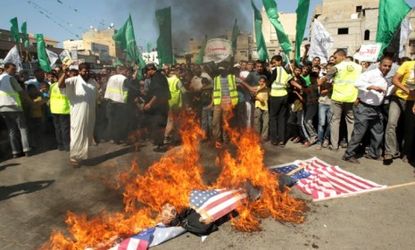 Palestinians burn U.S. flags during a protest on Sept. 14 against a U.S.-made online film that insults Prophet Mohammad.