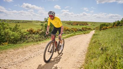 Male cyclist riding the Giant Revolt which is one of the best gravel bikes