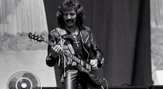 Tony Iommi performs with Black Sabbath in the West Coast sunshine as they play Day On The Green at the Oakland Coliseum, 1980. He must have been hot in those leathers.