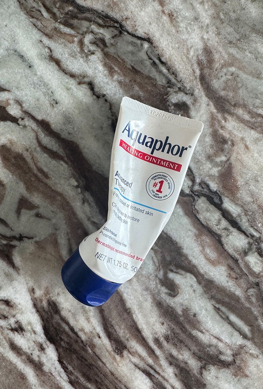 A photo of aquaphor on a marble table