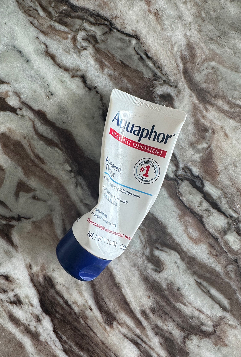 A photo of aquaphor on a marble table