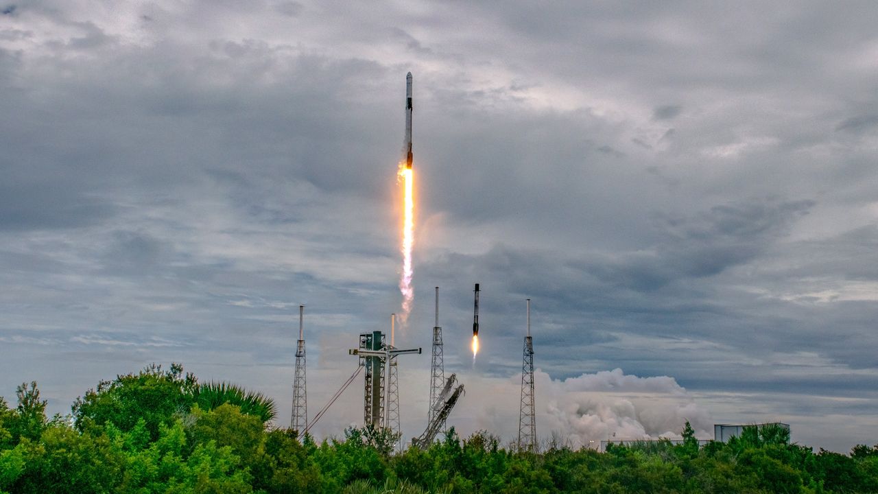 The launch and landing of a SpaceX Falcon 9 rocket with Crew Dragon spacecraft.