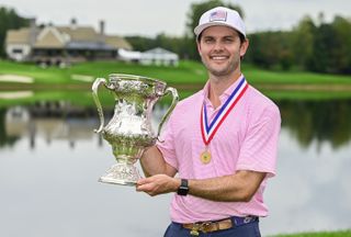 Evan Beck holds the US Mid Amateur Championship trophy