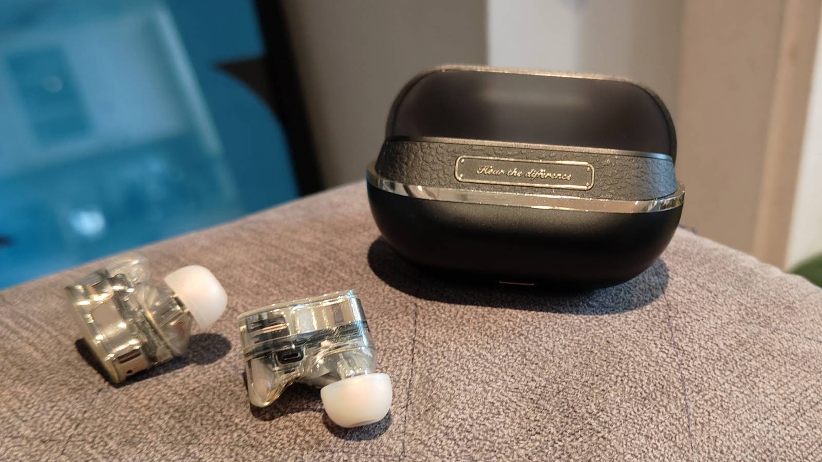 The Soundpeats H3 on the arm of a sofa.