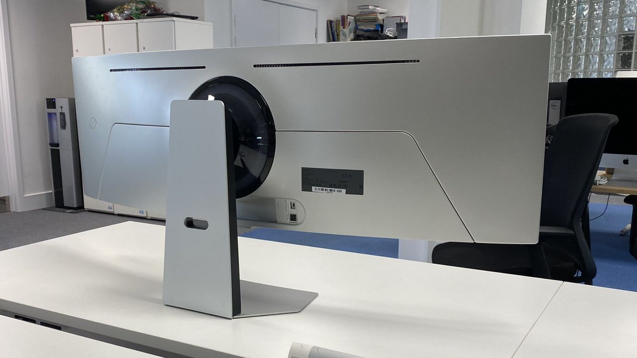 Samsung Odyssey OLED G9 from the back, showing its connection ports and stand