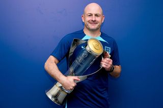 Lee Carsley, Head Coach of England poses for a photograph with the UEFA Under-21 Euro 2023 trophy after defeating Spain during the UEFA Under-21 Euro 2023 Final on July 08, 2023 in Batumi, Georgia. (Photo by Alex Caparros - UEFA/UEFA via Getty Images)