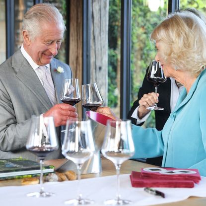 King Charles and Queen Camilla toasting with winte