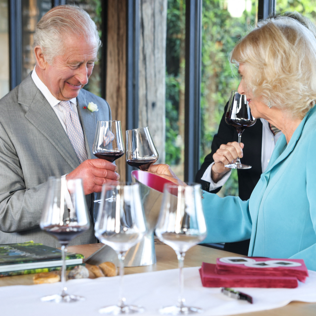 King Charles and Queen Camilla toasting with winte