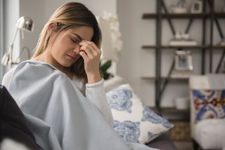Menstrual migraines: Young woman with headache