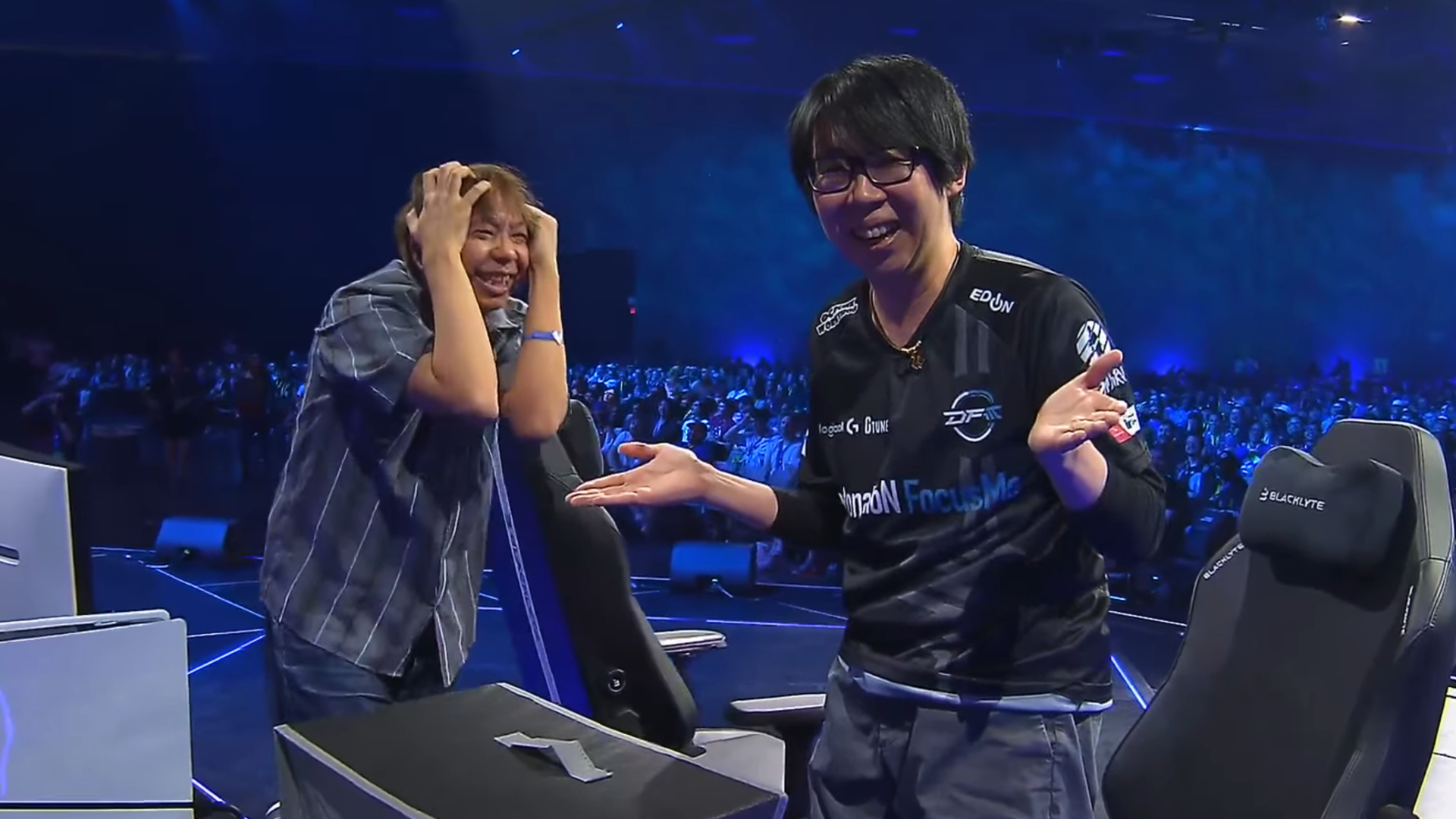 KogiKOG clutching his head in agony after a loss while GO1 looks at the camera with a smile and a shrug.