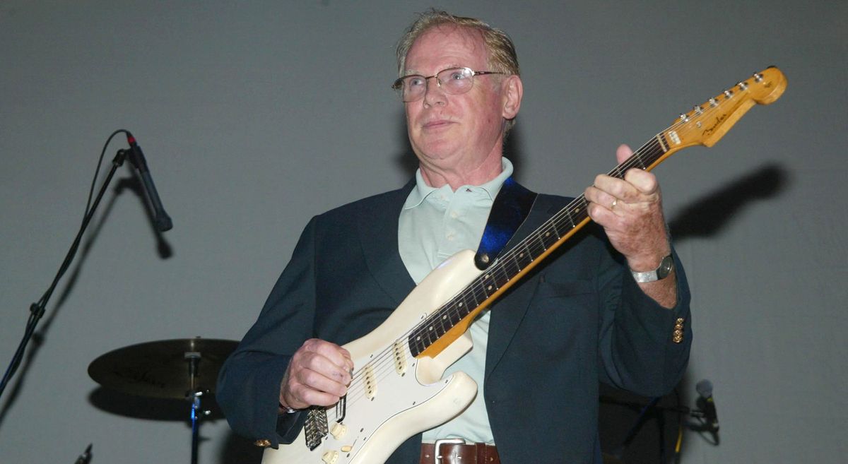 Vick Flick, legendary session ace, famous for his James Bond riff, plays his Olympic White Fender Stratocaster onstage in 2002 to promote the launch of the Beatles A Hard Day&#039;s Night on DVD – he played on the movie score too.