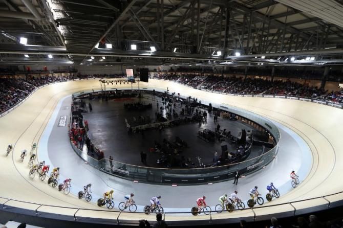 Cyclists race during the inauguration ceremony of the Saint-Quentin-en-Yvelines Velodrome
