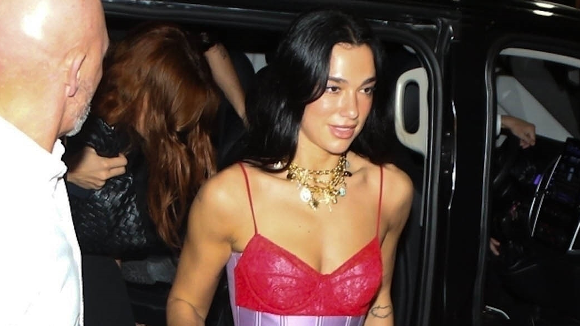 Dua Lipa was spotted in Brazil wearing a two-tone lacy corset, the dark denim trend, and a leopard-print Maison Margiela bag