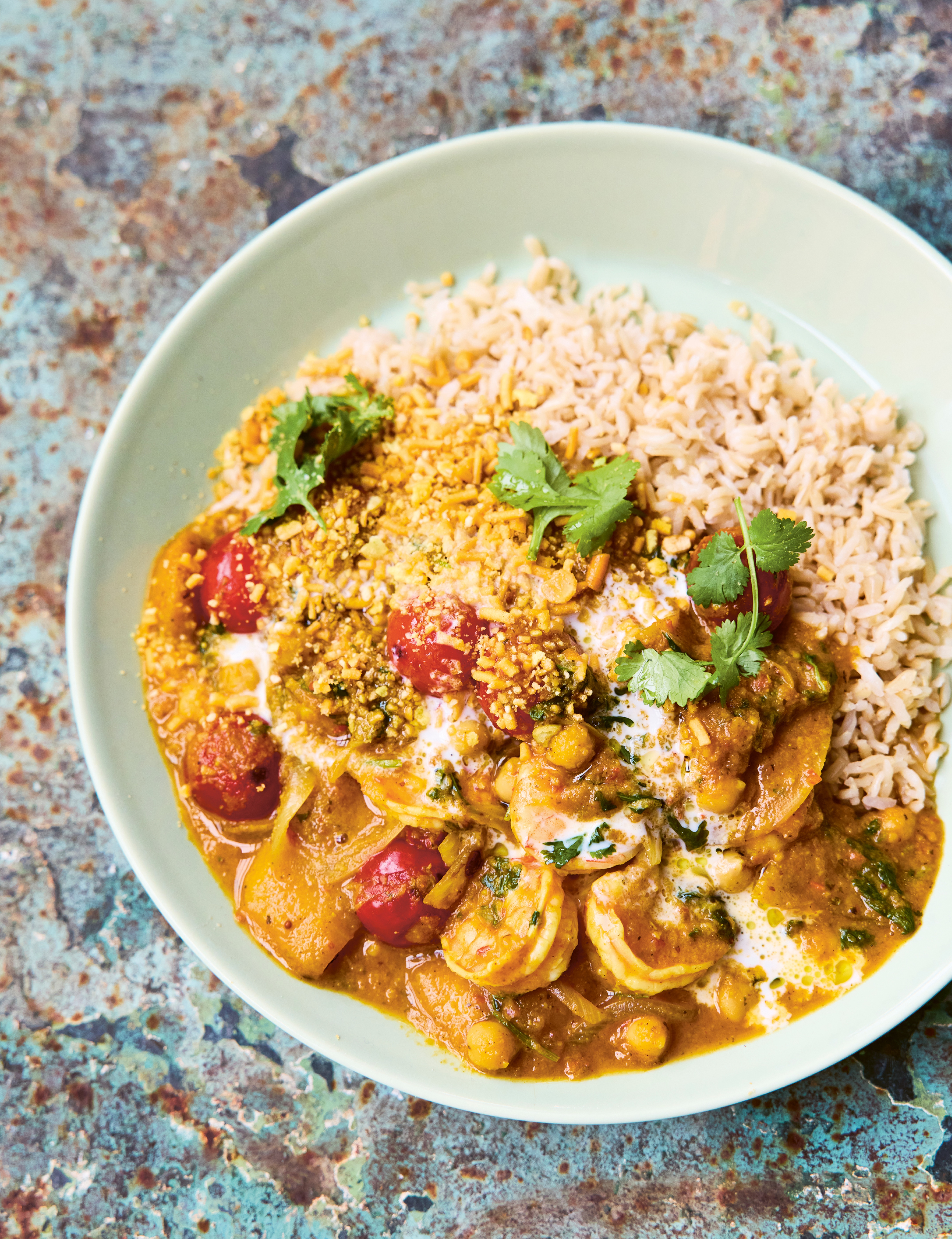A bowl of prawn curry with rice