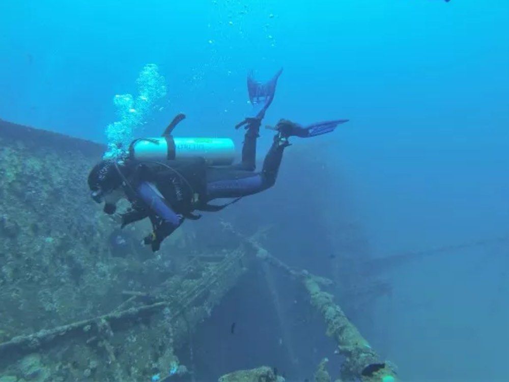 Vinisha Ranna, BDS, dives near wreckage in Sri Lanka. Ranna, a certified stress-and-rescue diver, is investigating the effect of scuba on the teeth.