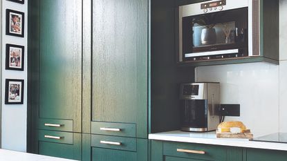 Green with with built-in microwave and coffee machine on counter