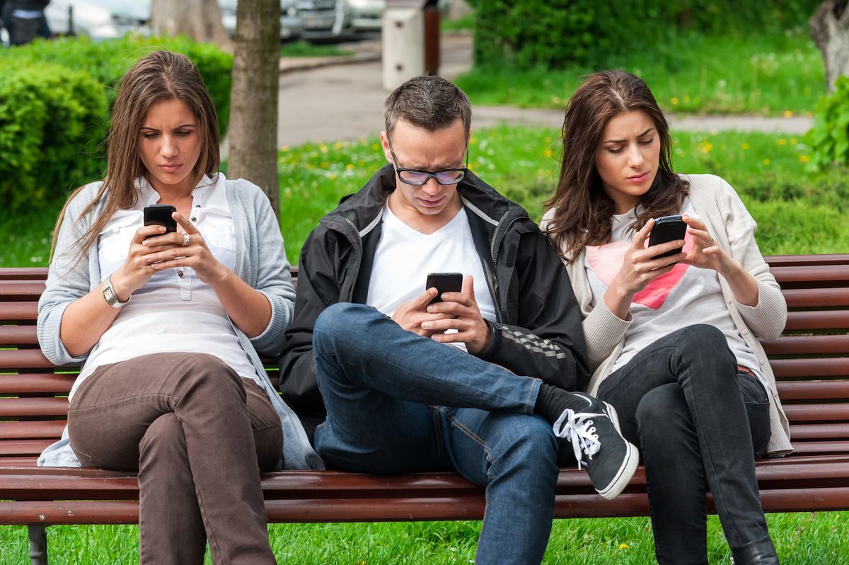 Friends looking at phones