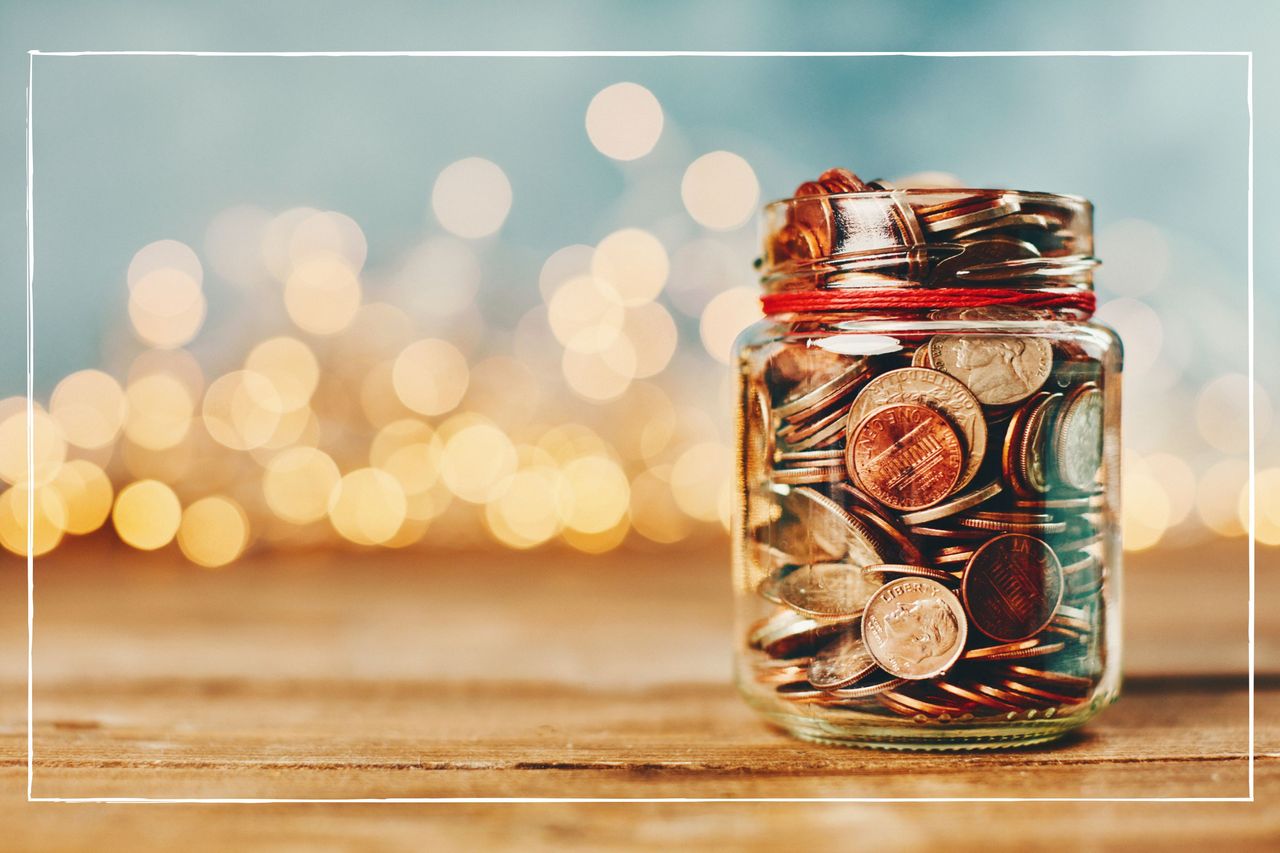 Christmas coin jar with Christmas lights behind 