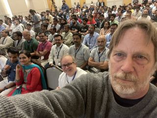 jim keller takes selfie in front of group of people