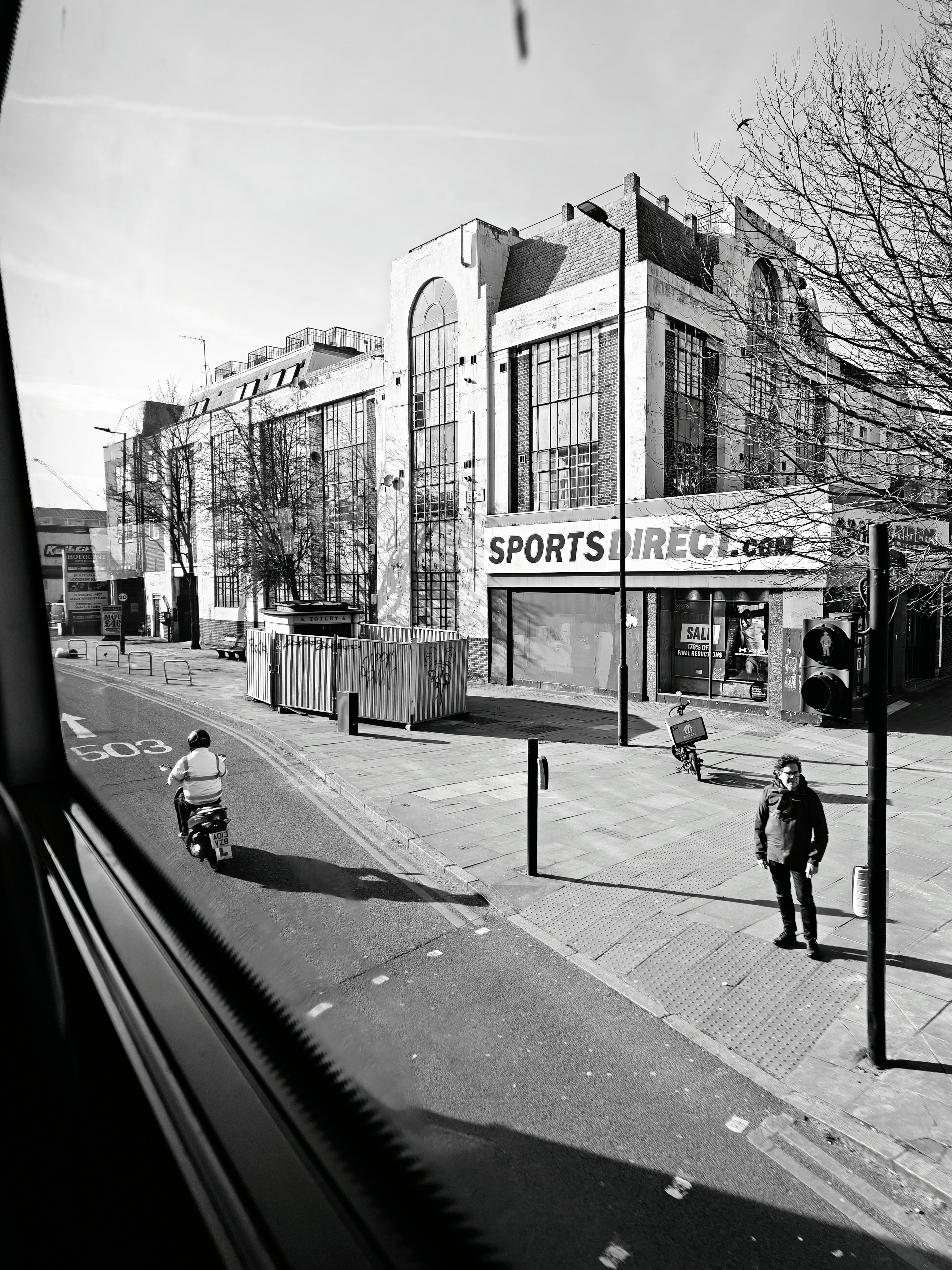 A street in London seen from a bus window