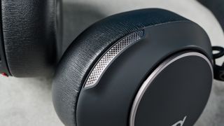 A black HP Poly Voyager Surround 80 UC wireless work-first headset