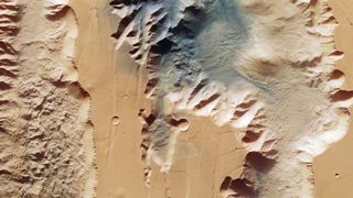 The Ius and Tithonium trenches that form part of the Valles Marineris on Mars, the largest canyon system in the solar system, photographed by the European Mars Express orbiter.