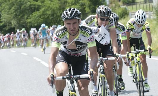 Geox-TMC riders lead the chase of the five-man break.