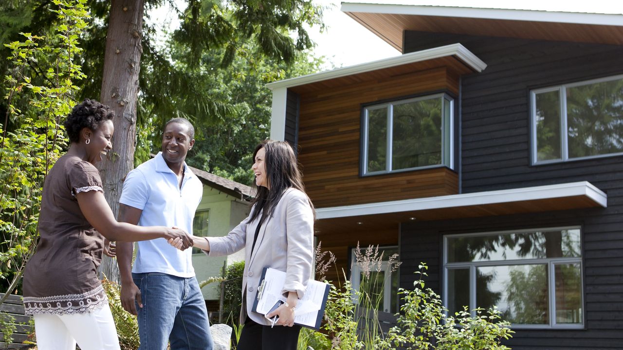 couple buys a house