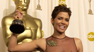 Halle Berry posing with her Oscar statuette.