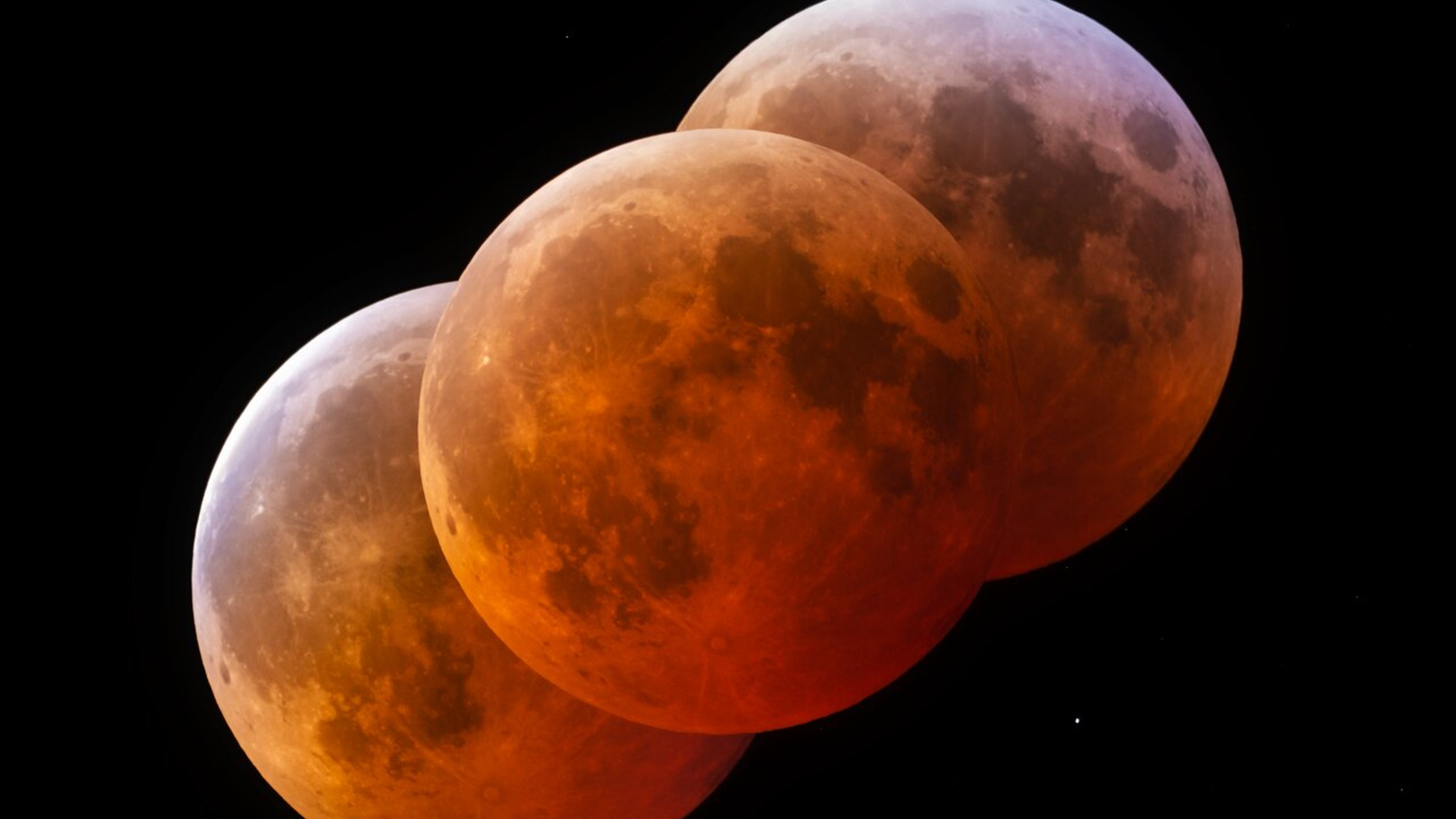 Three blood red moons overlaid on each other in a diagonal pattern against a dark background