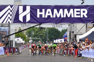 The Hammer Series peloton comes across the finish line.