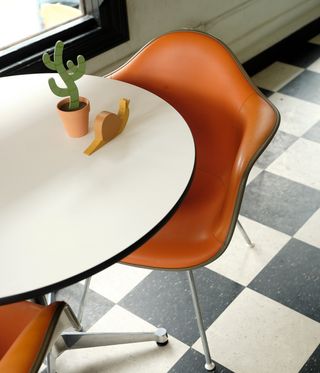 tables in cafe on black and white floor