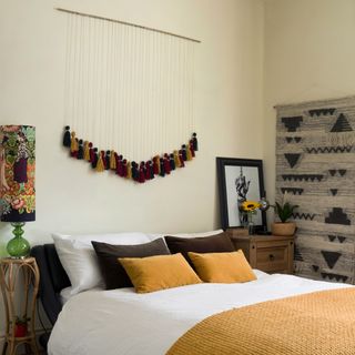 bedroom with macrame hanging and bedroom rug
