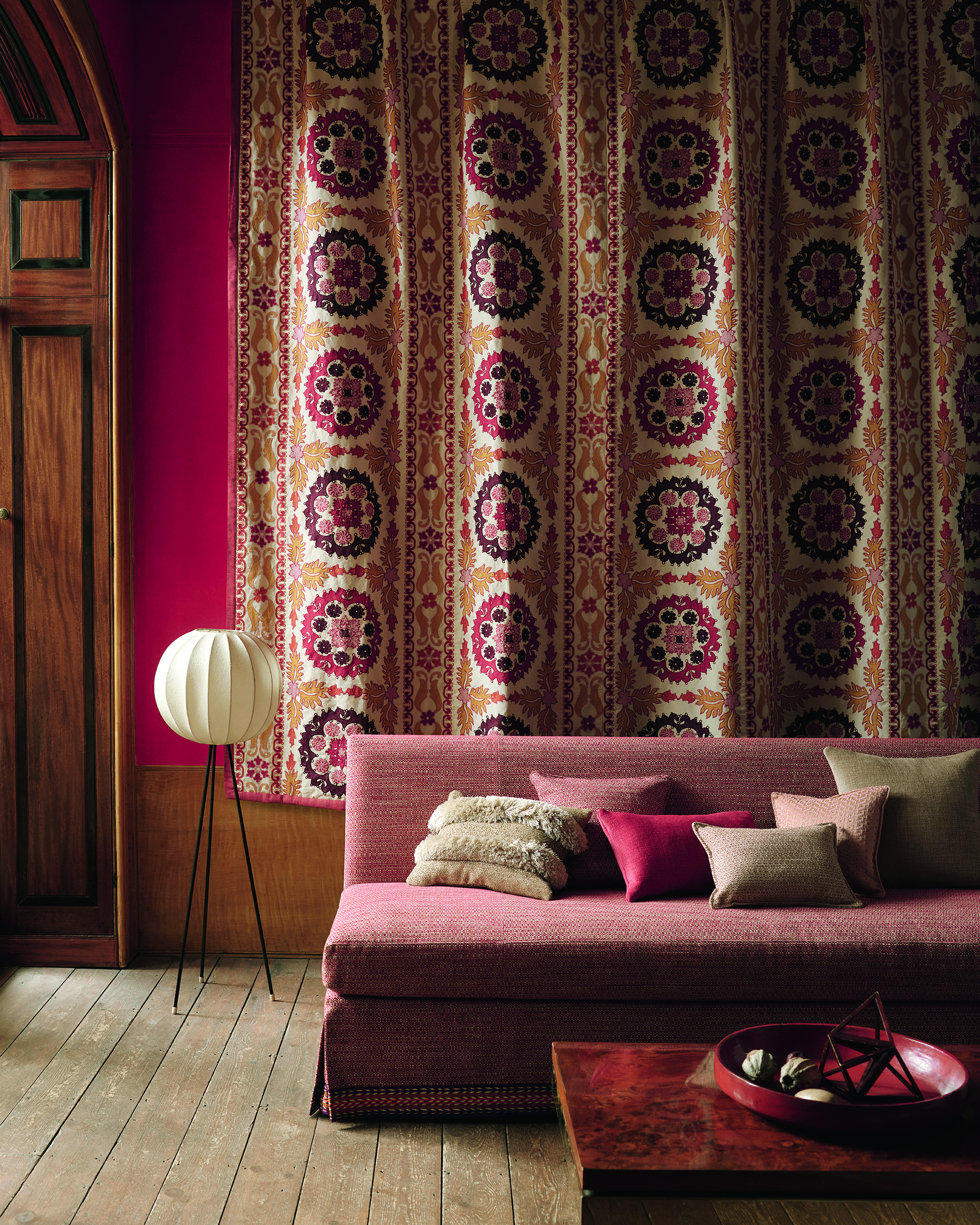 Boho-style room with warm colored sofa