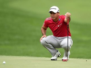 Jason Day's red putter has minimal alignment assistance