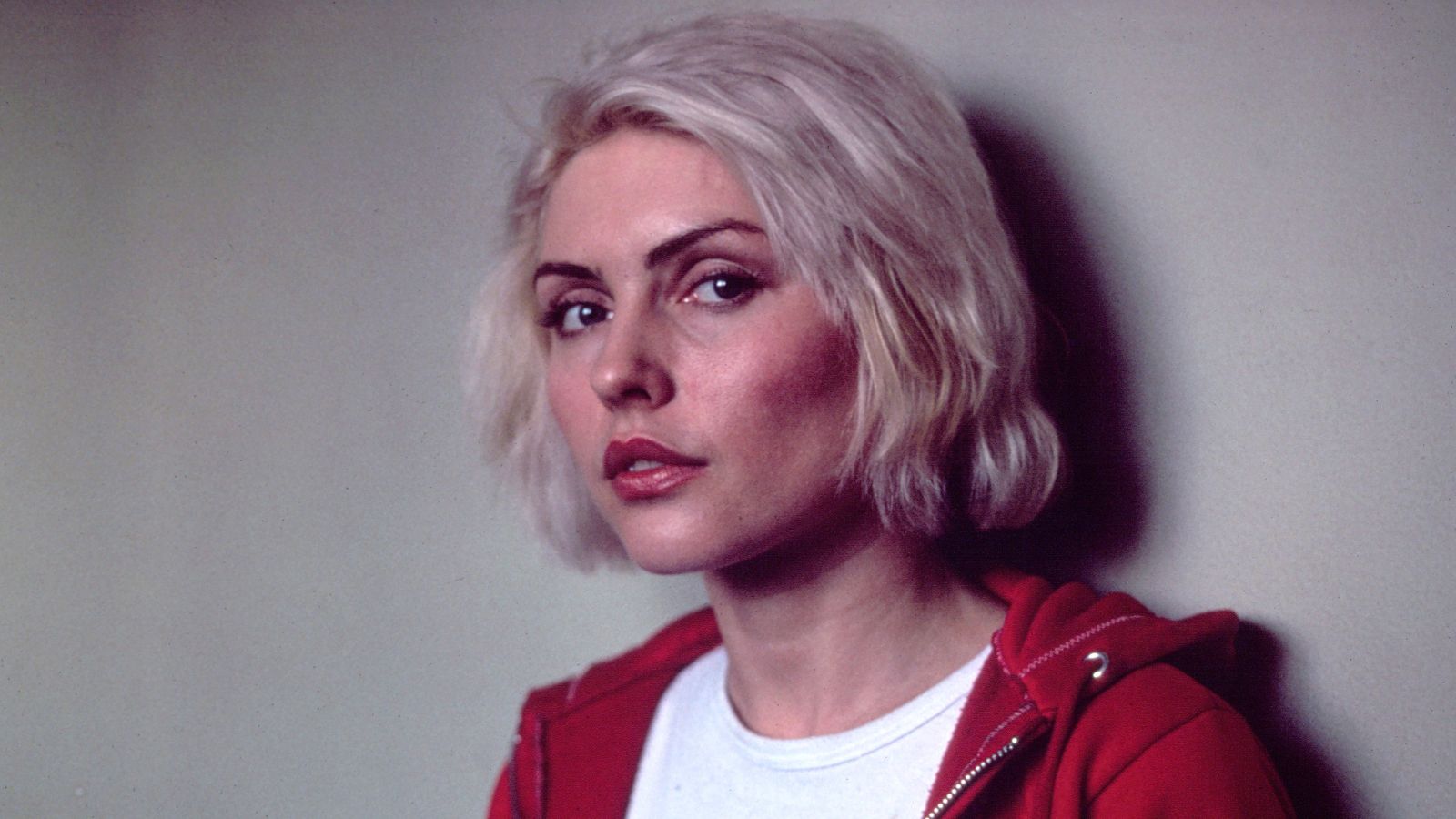 debbie harry on a white background with a red hoodie