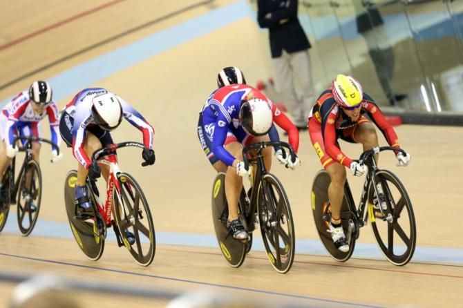 Head down - Rebecca James (GBr) pushes ahead to win her Keirin heat in round 1.
