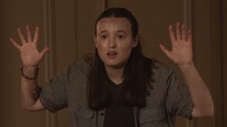 Ellie worried with hands up at gunpoint in The Last of Us Season 2 finale