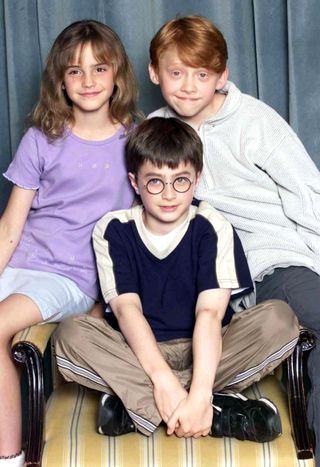 Actors Emma Watson, Rupert Grint and Daniel Radcliffe attend a photocall to present the new cast of the Harry Potter