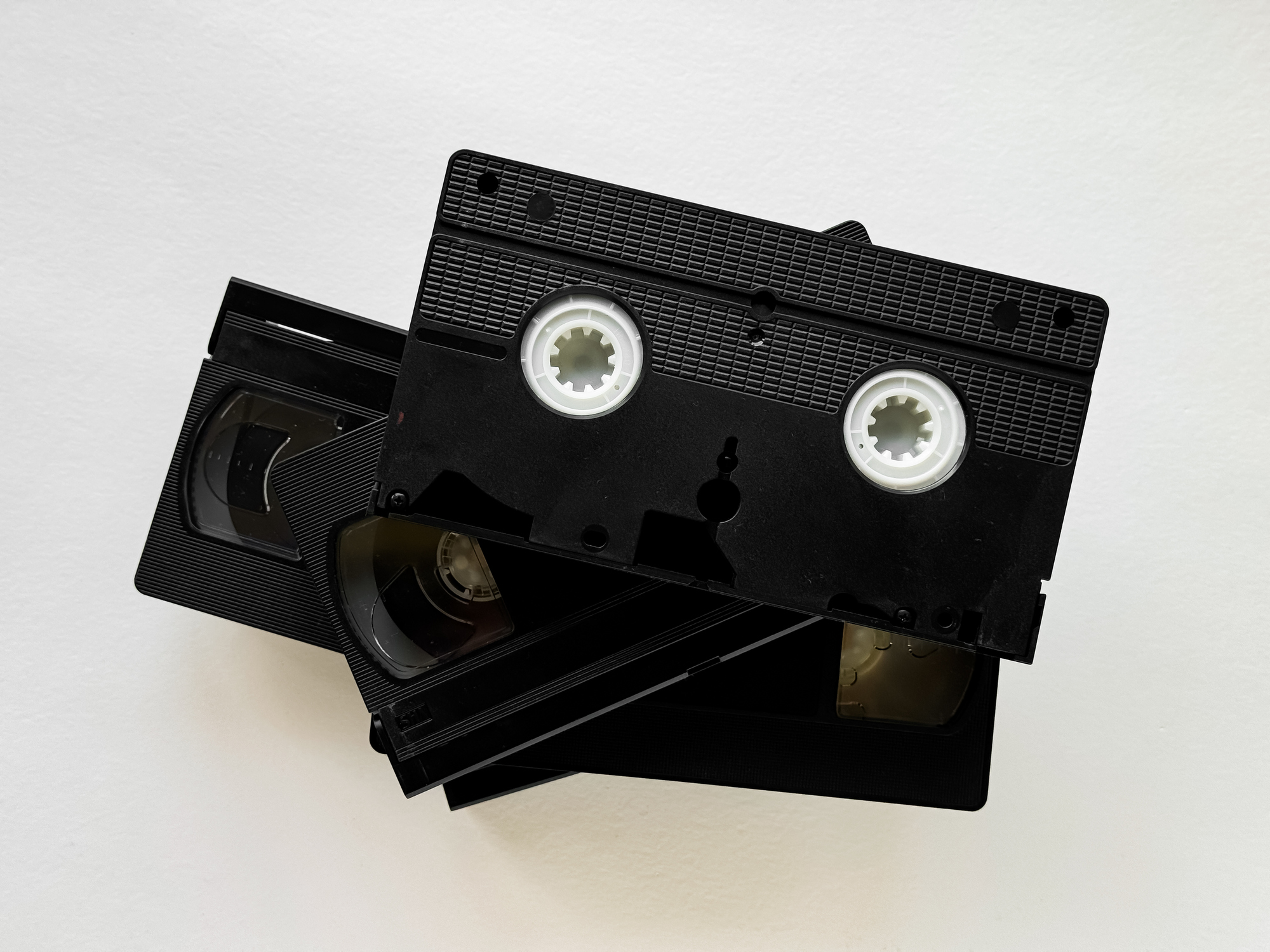 Vintage vhs cassettes on white background highlighting retro technology and 80s nostalgia