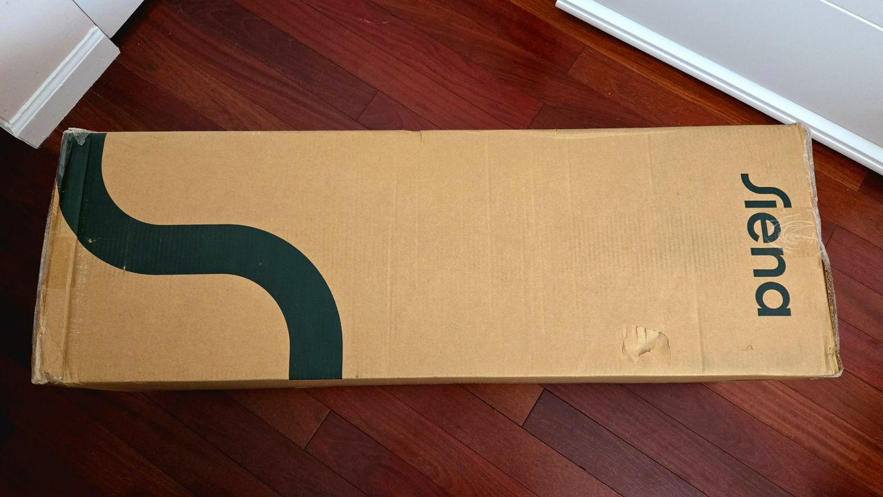 Siena Premier Hybrid Mattress box placed horizontally on a Brazilian redwood floor