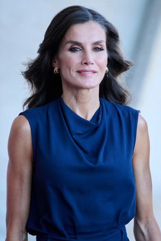 Queen Letizia of Spain wears a blue top and skirt as she arrives at an institutional act of recognition to professionals and volunteers who participated in the different fire extinguishing work in Tenerife at the Arafo Cultural and Recreation Center on October 24, 2023 in Santa Cruz de Tenerife, Spain.