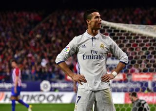 Cristiano Ronaldo celebrates after scoring his third goal for Real Madrid against Atletico Madrid at the Vicente Calderon in November 2016.