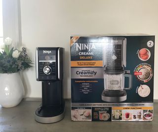 Ninja Creami Deluxe with its box on a countertop