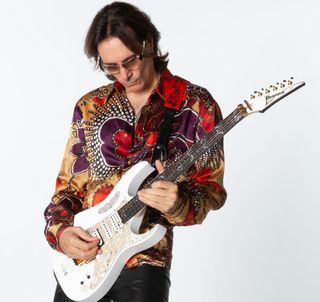 Steve Vai with his signature Ibanez JEM