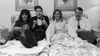 Cheap Trick lying in bed