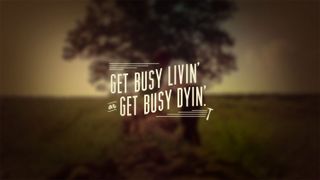 Blurred image of a tree with text overlaid saying 'Get busy livin' or get busy dyin''