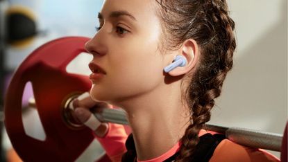 Huawei Freebuds 5i review: woman wearing true wireless earbuds