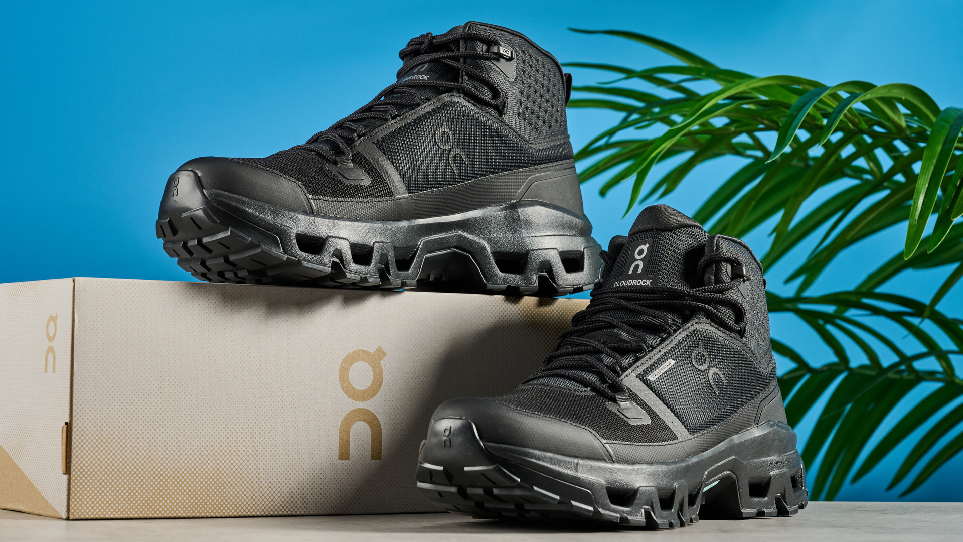 The On Cloudrock Mid WP boots with one boot on top of the box