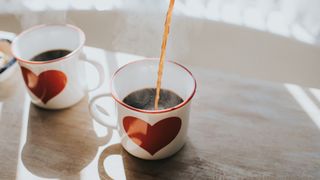 black coffee being poured into a mug